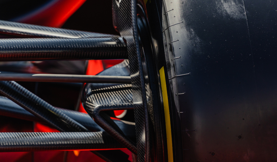 F1 car suspension close-up showing precision engineering components