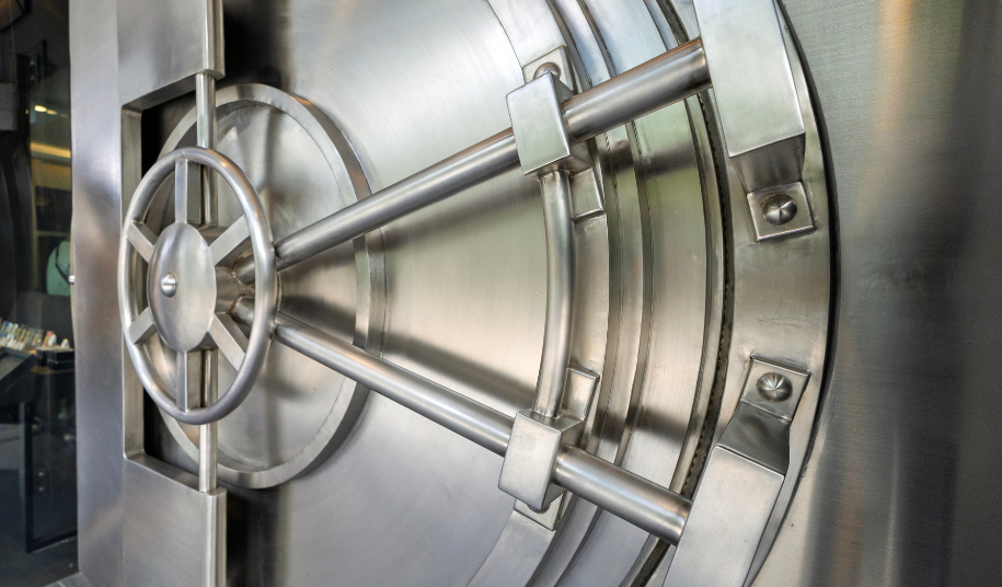 Locked bank vault door representing security of client cash at Casterbridge Wealth
